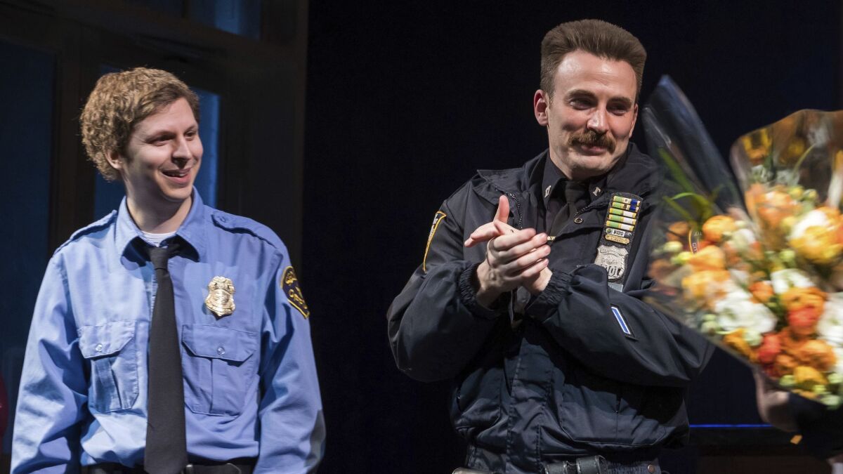 Michael Cera, left, and Chris Evans appear at the curtain call for the Broadway opening night of "Lobby Hero" at the Hayes Theater.