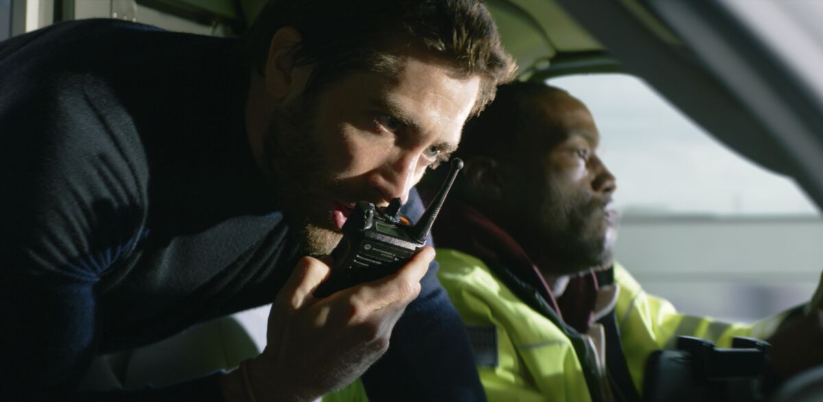 This image released by Universal Pictures shows Jake Gyllenhaal, left, and Yahya Abdul-Mateen II in a scene from "Ambulance." (Universal Pictures via AP)