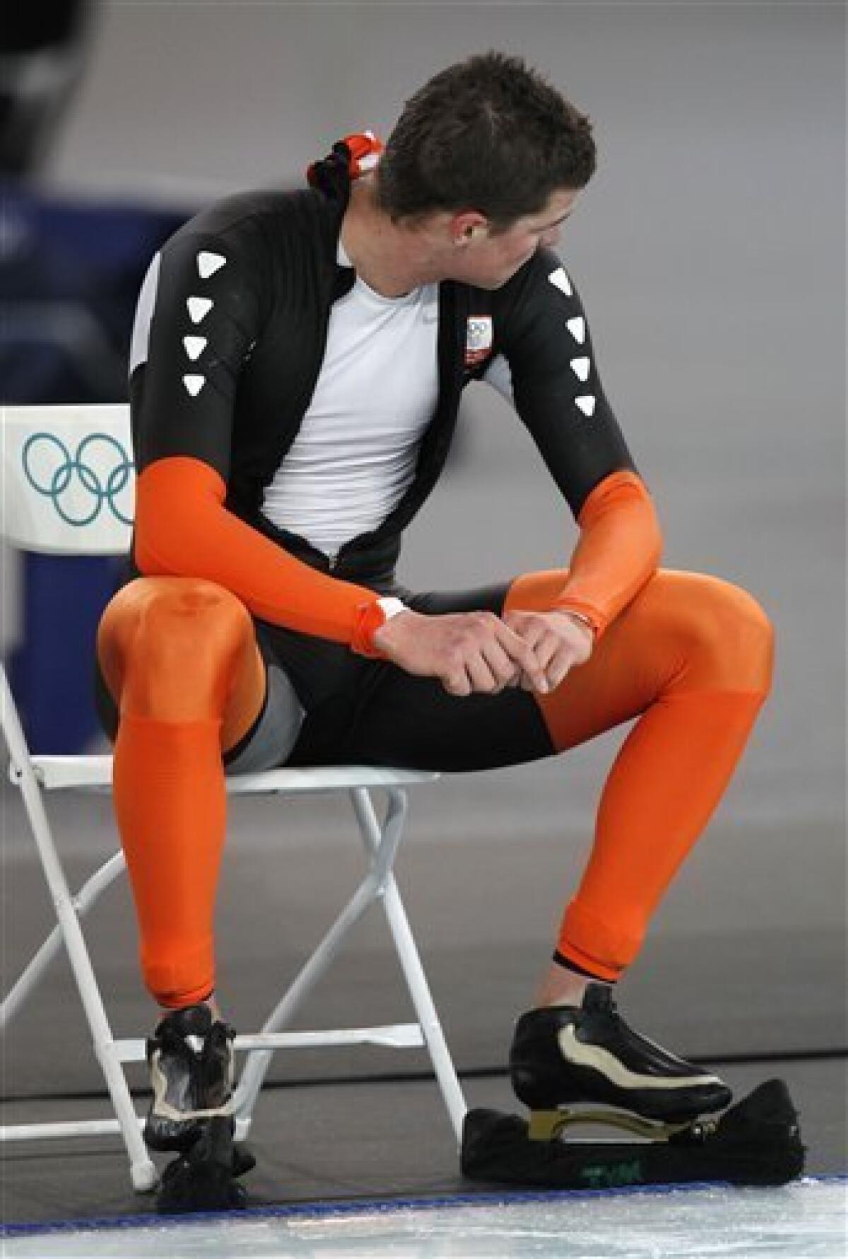 Netherlands's Sven Kramer reacts after he was disqualified during the men's 10,000 meter speed skating race at the Richmond Olympic Oval at the Vancouver 2010 Olympics in Vancouver, British Columbia, Tuesday, Feb. 23, 2010. Lee Seung-hoon of South Korea won a stunning gold medal in men's 10,000-meter speedskating Tuesday when overwhelming favorite Sven Kramer made an amateurish mistake, failing to switch lanes just past the midway point of the race, and was disqualified. (AP Photo/Kevin Frayer)