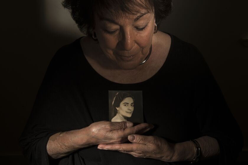 PACIFIC PALISADES, CA-APRIL 27, 2023: Alice Lynn, 83, holds a photograph of her mother, Varsen Katsky, maiden name, Varsen Topoozian, who passed away in 1982 at the age of 79. Lynn, a working family therapist, is having her own struggles, much of her family is gone, friends are dying fast, and she's trying to cope with the crippling impact of loss and fear of her own mortality. (Mel Melcon / Los Angeles Times)