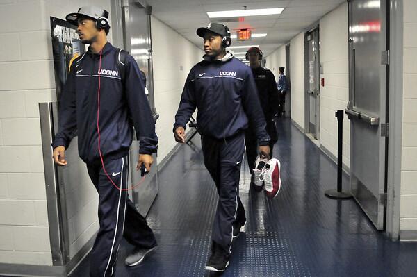 UConn's Jamal Coombs-McDaniel, left, and Donnell Beverly walk into the Verizon Center.