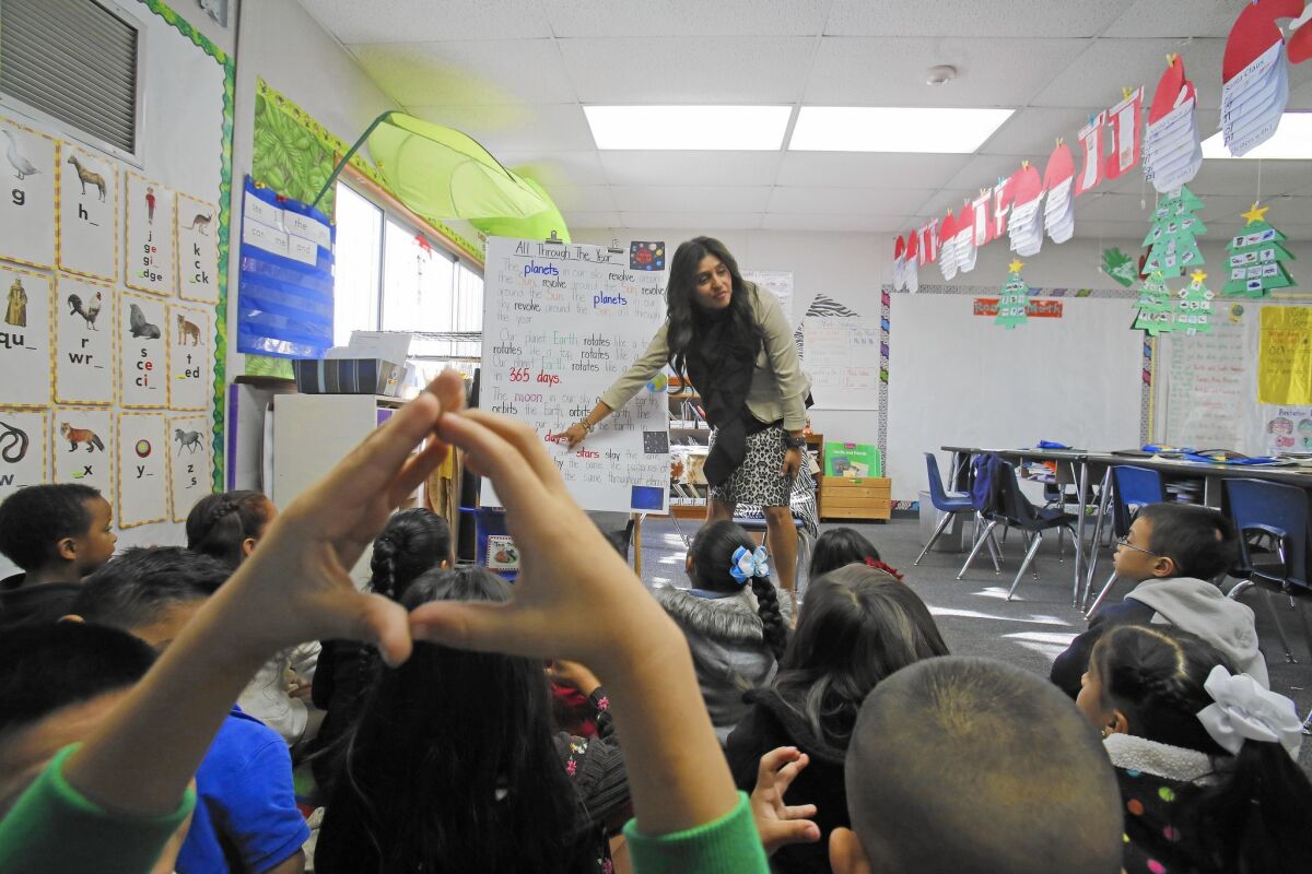 First-grade teacher April Alonzo-Soto does content-based chants with her class at Parkview Elementary in El Monte. The school uses a curriculum that incorporates literature, social studies and science to help students learn English.