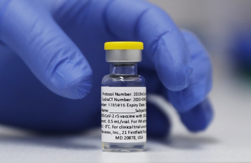FILE - A vial of the Phase 3 Novavax coronavirus vaccine prepared for use in a trial at St. George's University hospital in London on Wednesday, Oct. 7, 2020. On Thursday, Feb. 10, 2022, Novavax announced that its protein-based COVID-19 vaccine proved safe and effective in a study of 12- to 17-year-olds. (AP Photo/Alastair Grant, File)