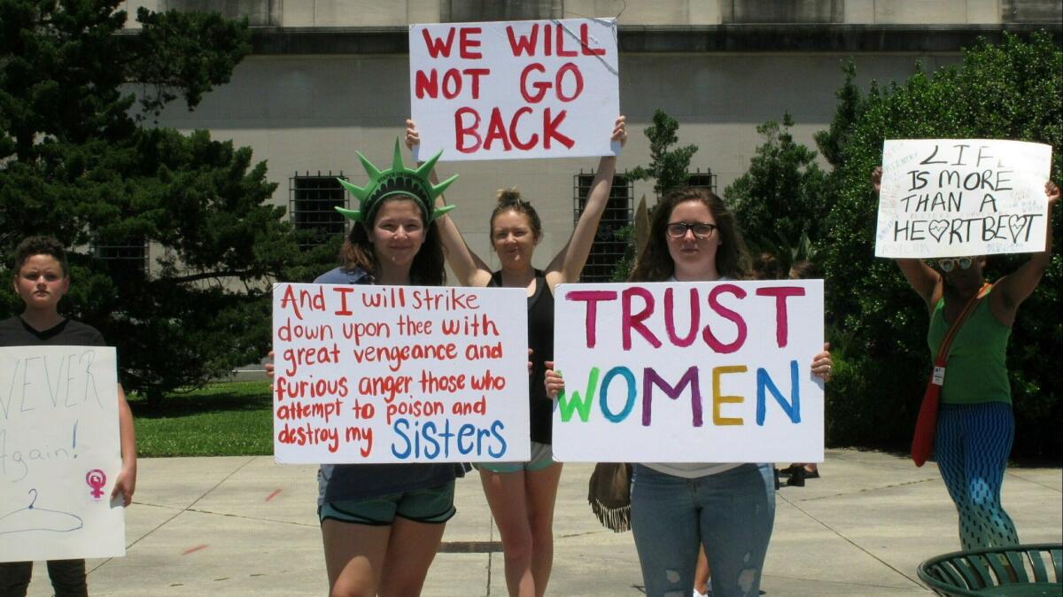 Abortion rights supporters protest at the Louisiana Capitol in Baton Rouge.