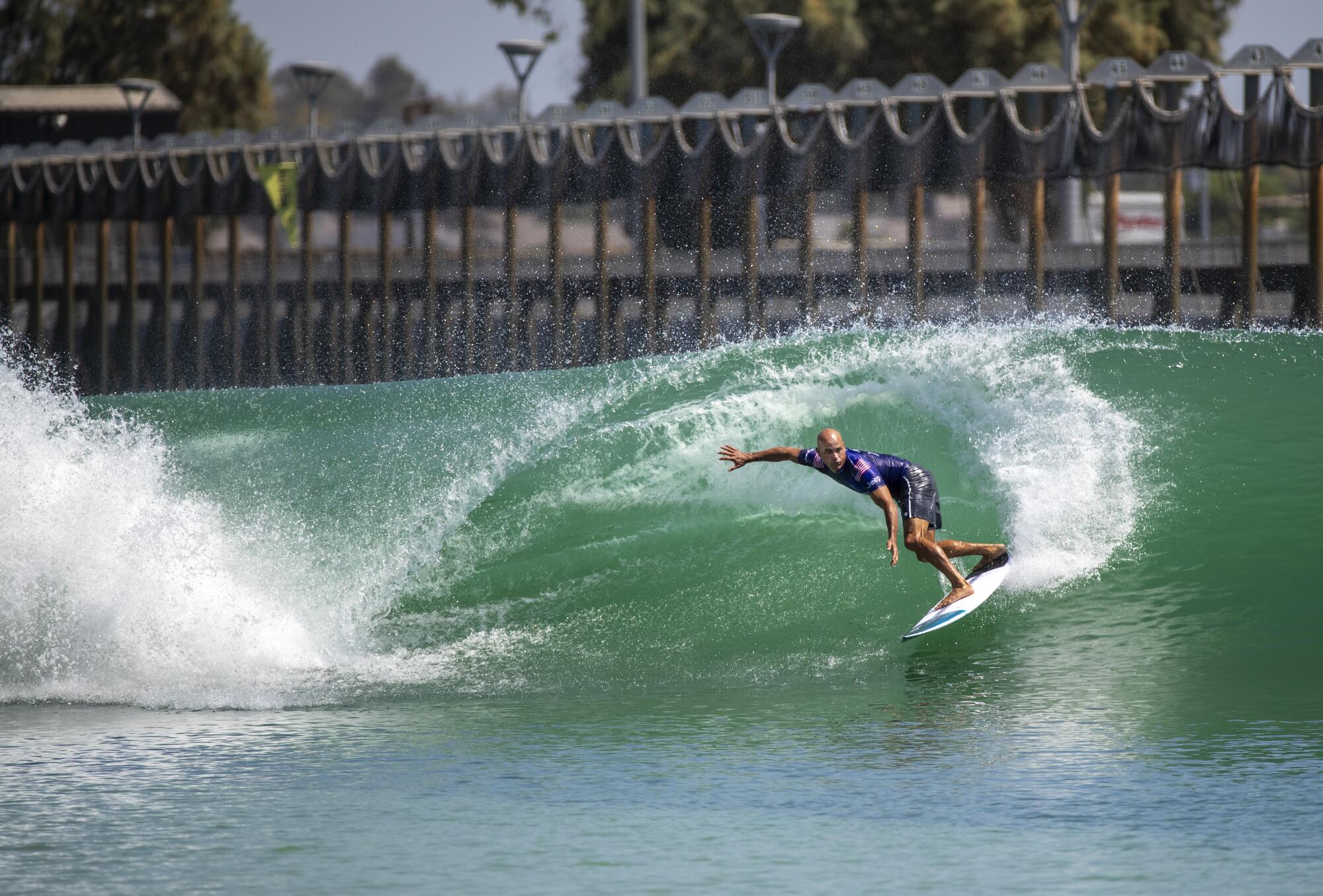 Surf Ranch innovator and 11-time world champion surfer Kelly Slater, of Florida, does a slashing turn off a wave.