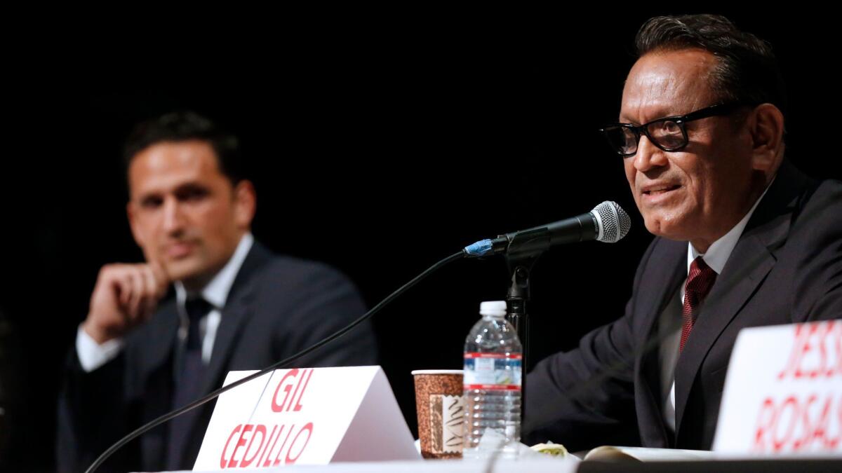 City Council rivals Joe Bray-Ali, left, and Gil Cedillo at a forum last month. Cedillo may have narrowly avoided a runoff, but many provisional and late mail ballots remain to be counted.