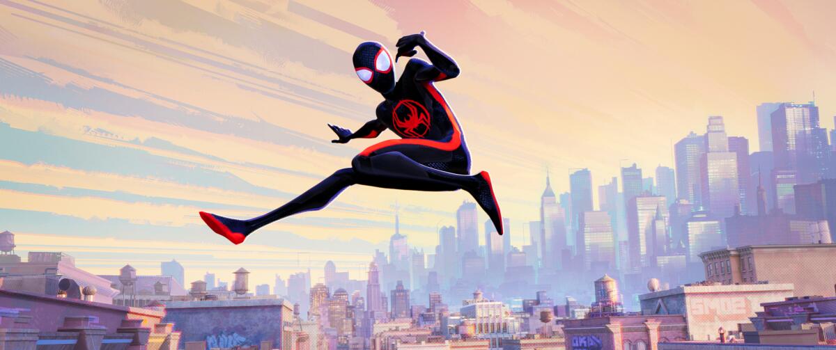 An animated Spider-Man soars through the air above a city-=scape in "Spider-Man: Across the Spider-Verse."
