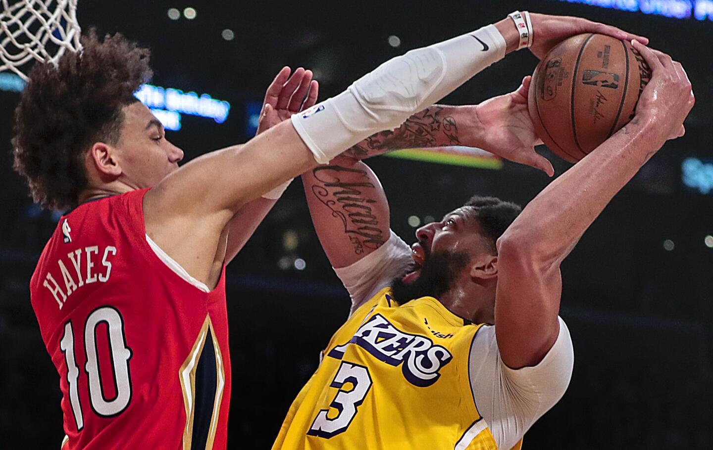 Pelicans center Jaxson Hayes fouls Lakers forward Anthony Davis in the first half Friday night. Davis finished with 46 points.