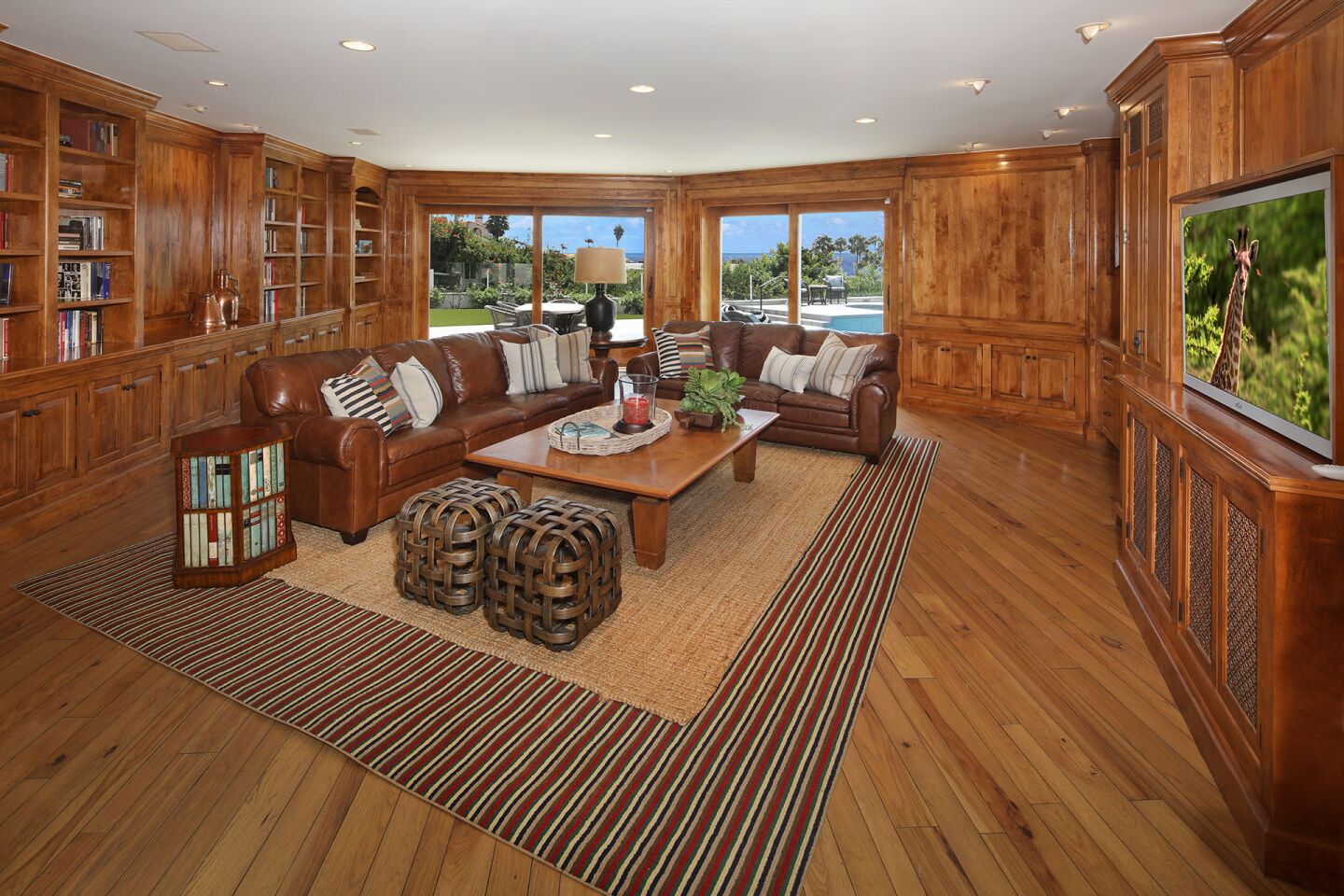 The den has wood paneling.