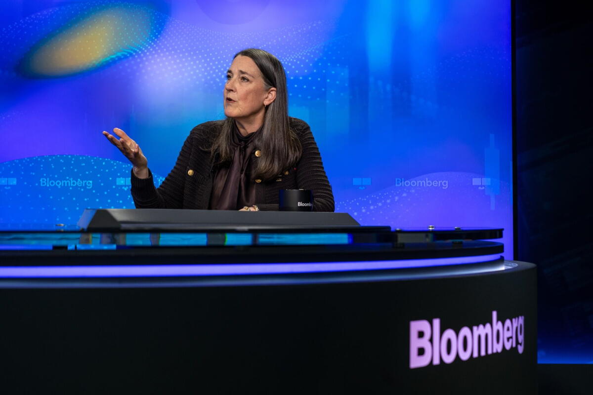 Patti Poppe speaks at a desk.