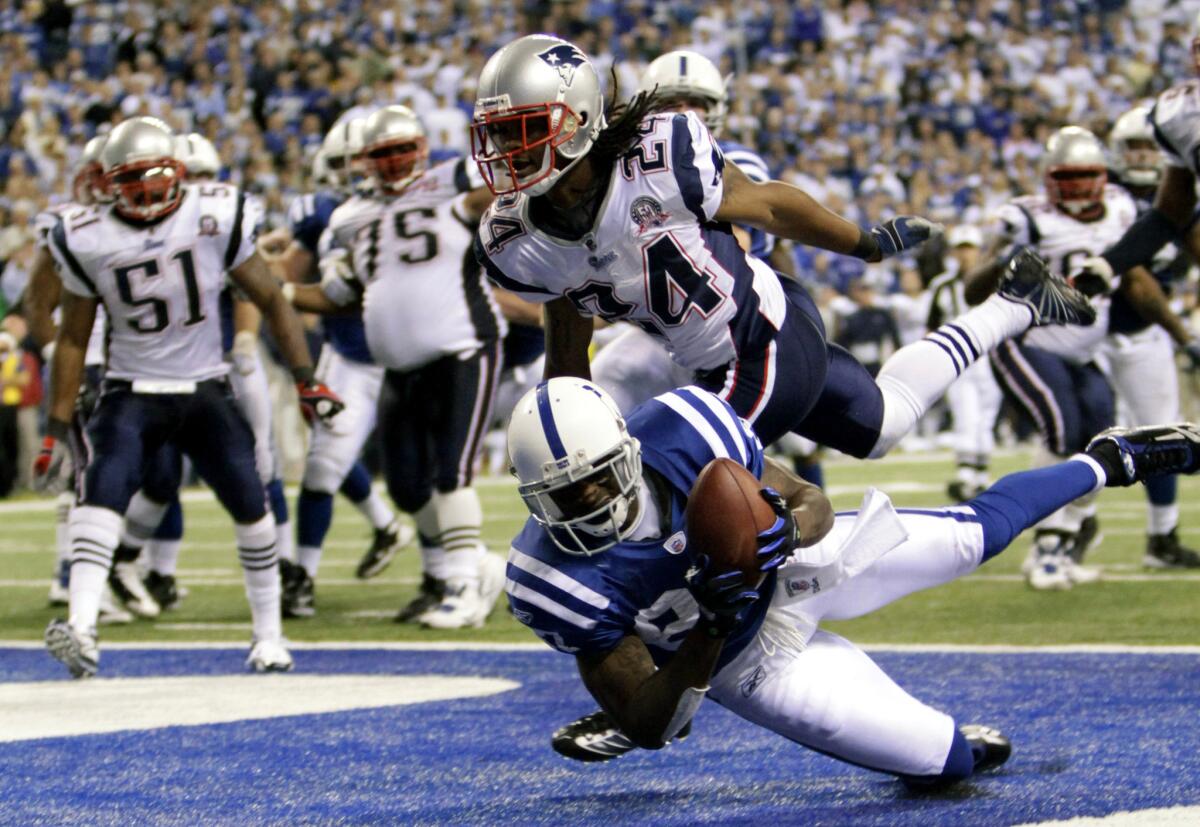 Reggie Wayne scores a winning touchdown for the Colts against New England in Indianapolis on Nov. 16, 2009.