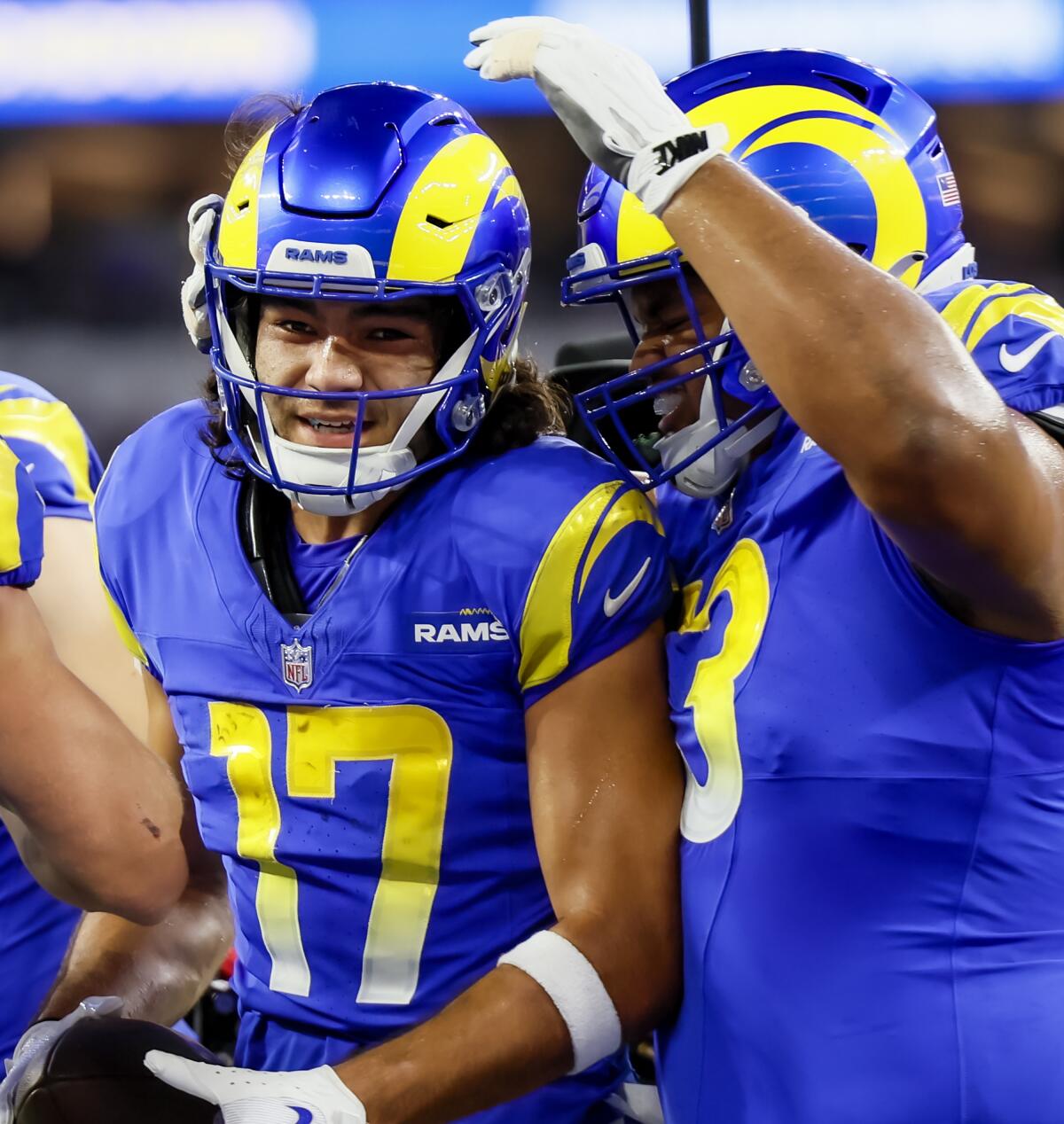 Rams wide receiver Puka Nacua, left, celebrates after catching a touchdown pass in the first quarter Thursday.