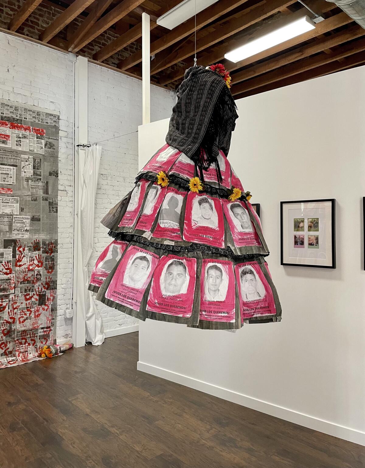"Falda de Ayotzinapa," by Lisa Alvarez, a multimedia garment suspended as the centerpiece of the show.