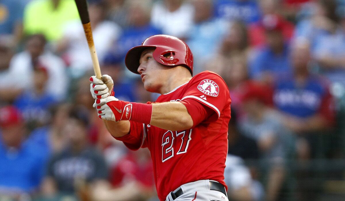 Angels center fielder Mike Trout, hitting a home run against the Rangers, has taken part in home run derbys before and knows it can take a toll.