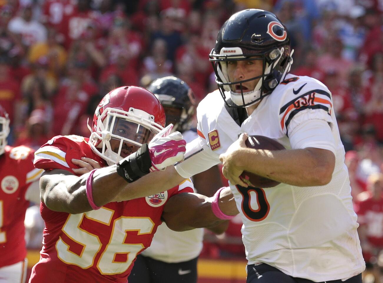 Jay Cutler breaks a tackle by Chiefs linebacker Derrick Johnson during the second half.