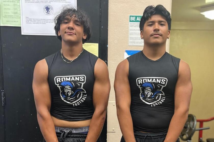 Los Angeles High linebackers Arturo Arguello (left) and Jeshua