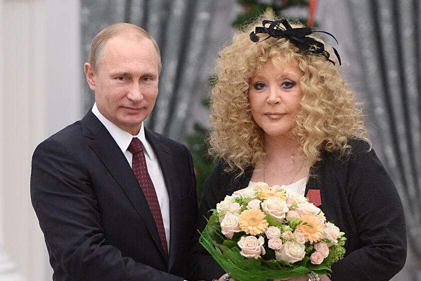 FILE - Russian President Vladimir Putin, left, and Russian pop singer Alla Pugacheva 
