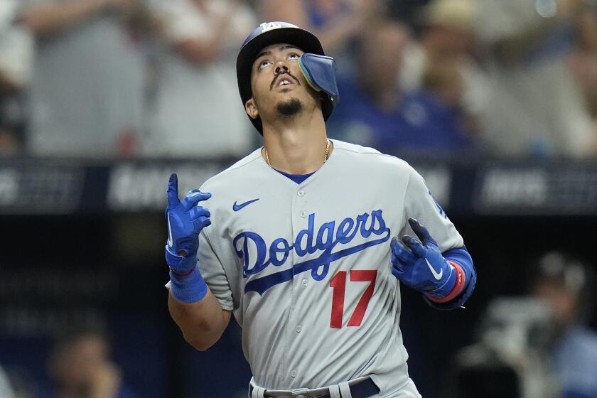 Los Angeles Dodgers' Miguel Vargas reacts after his solo home run off Tampa Bay Rays relief pitcher Trevor Kelley.