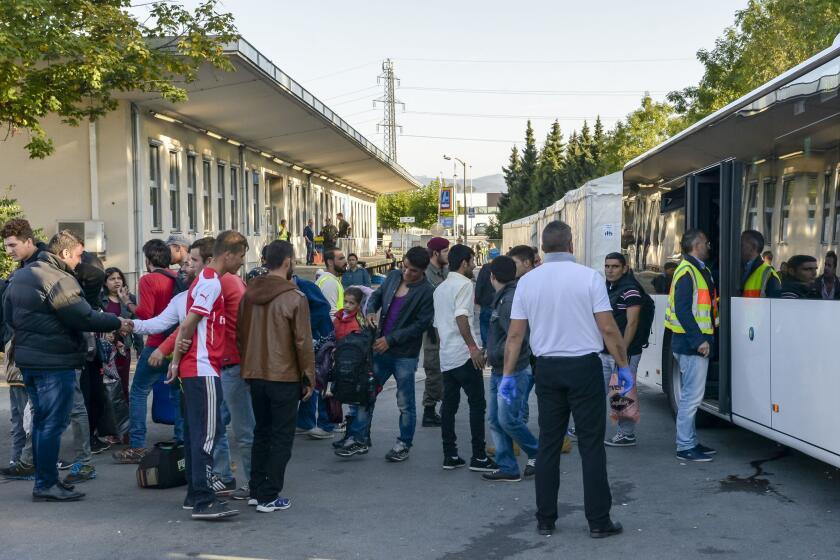 New migrants arrive at a refugee camp located in the Austrian city of Salzburg, near the German border, on Oct. 2.