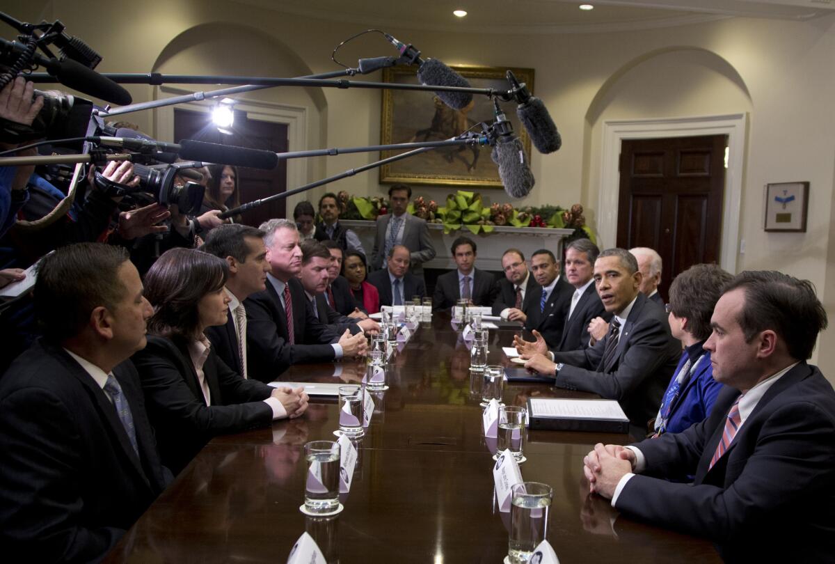 President Barack Obama, accompanied by Vice President Joe Biden, speaks to media in the Roosevelt Room of the White House in Washington, Friday, Dec. 13, 2013, before a meeting with mayors and newly-elected mayors from across the country to discuss job creation and ensuring middle class families have a pathway to opportunity. Across the President, from second from left are, Minneapolis Mayor-elect Betsy Hodges, Los Angeles Mayor Eric Garcetti, New York City Mayor-elect Bill de Blasio, Boston Mayor-elect Martin Walsh, Pittsburgh Mayor-elect William Peduto, Rochester, N.Y., Mayor-elect Lovely Warren, Detroit, Mich., Mayor-elect Mike Duggan, Jersey City, N.J. Mayor Steven Fulop, and Harrisburg, Pa.,Mayor-elect Eric Papenfuse. David Agnew, White House Director for Intergovernmental Affairs is at right, White House Senior Adviser Valerie Jarrett is second from right.