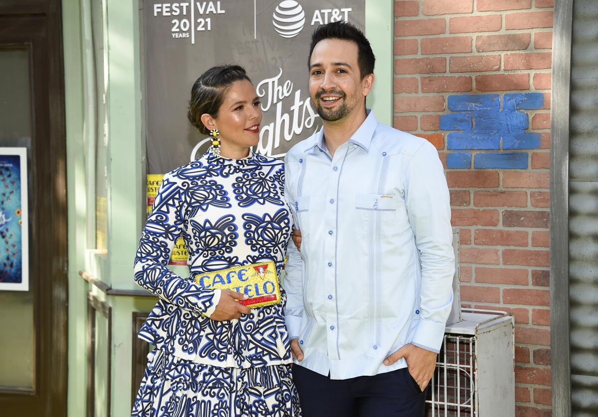 Lin-Manuel Miranda, in a guayabera, and Vanessa Nadal, holding a Cafe Bustelo clutch, on the red carpet