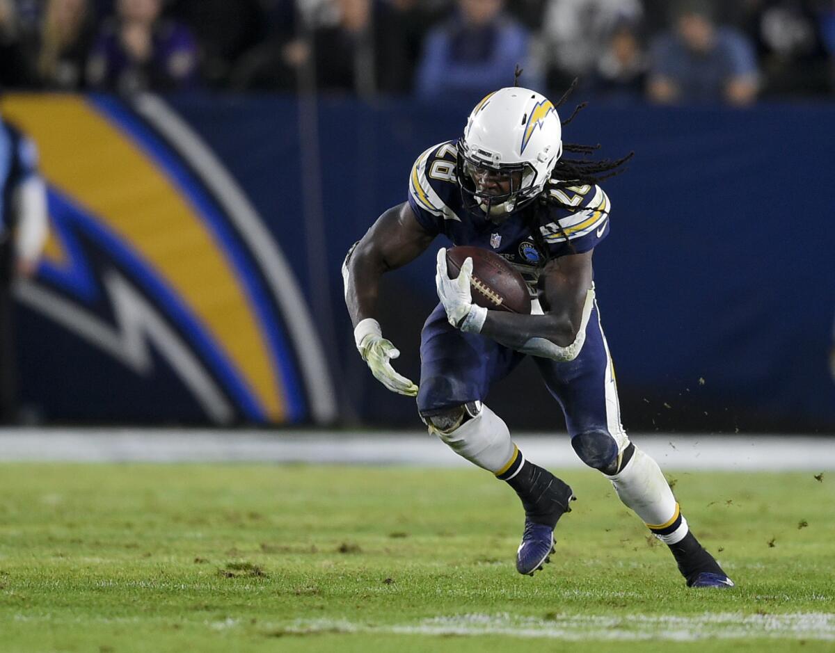 Chargers running back Melvin Gordon runs the ball during the second half against the Baltimore Ravens in Carson on Dec. 23, 2018.