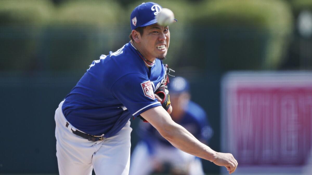 Dodgers starting pitcher Kenta Maeda pitches in the second inning of a spring training game against the Seattle Mariners on Saturday in Phoenix.