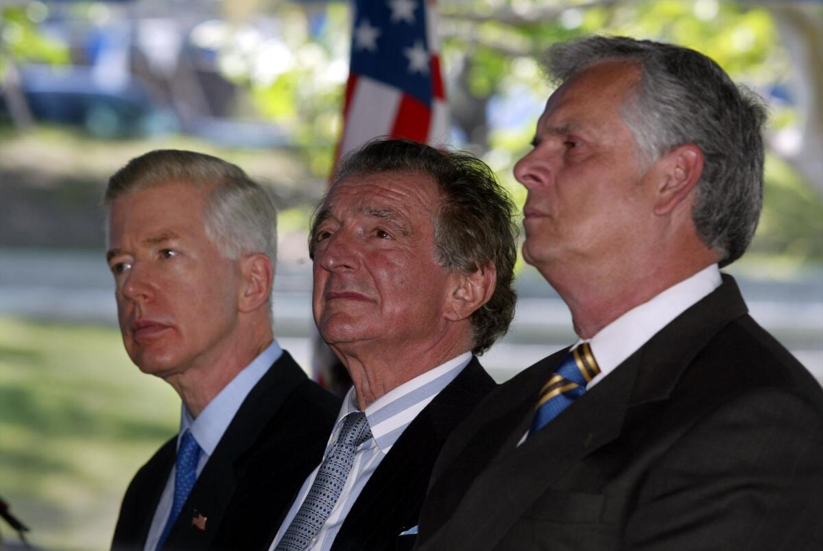 Real estate developer Jona Goldrich, center, is flanked by Gov. Gray Davis, left, and L.A. Mayor James Hahn at a 2003 ceremony at the Los Angeles Museum of the Holocaust.