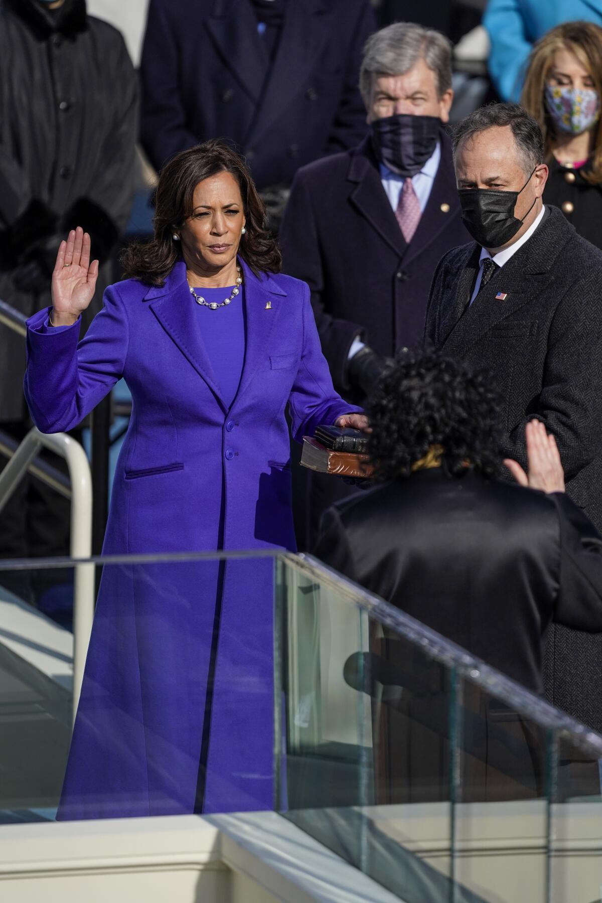 U.S. Vice President-elect Kamala Harris takes the oath of office from Supreme Court Justice Sonia Sotomayor on Wednesday.