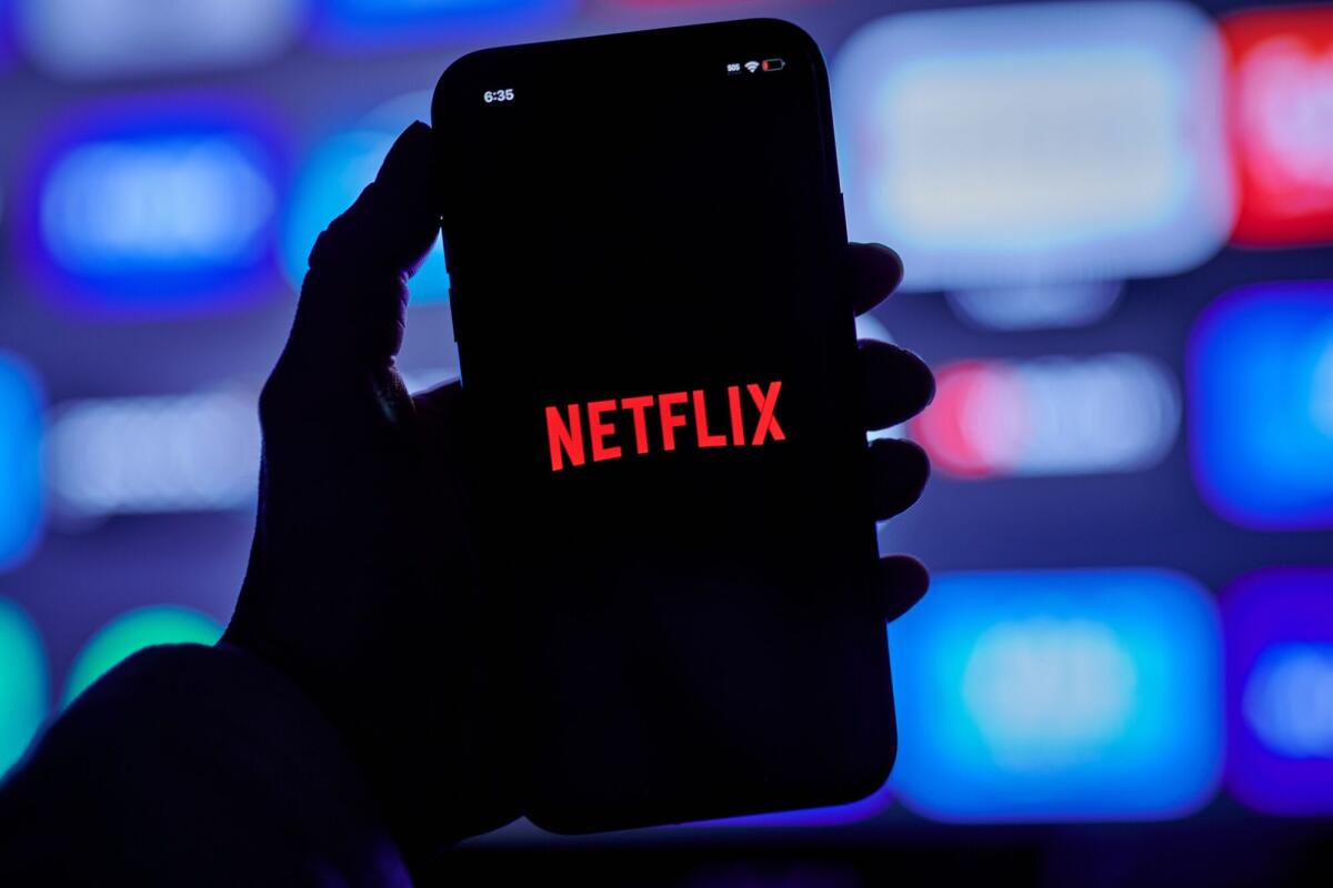 The Netflix logo on a smartphone.
