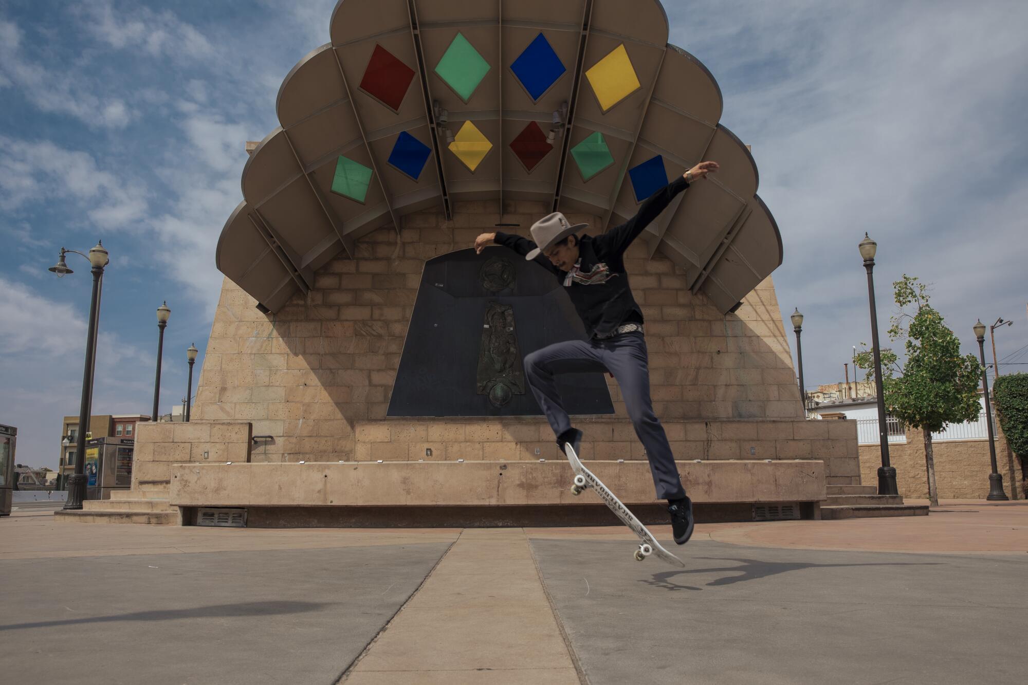 Steve Corona, 31, wears ranchero style clothing while skating at Mariachi Plaza in Boyle Heights on September 23, 2023.