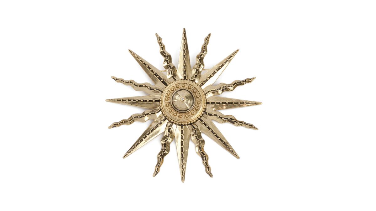 Fausto Puglisi gold brass Iconic Sun pin, $290 at Curve in West Hollywood, (310) 360-8088.