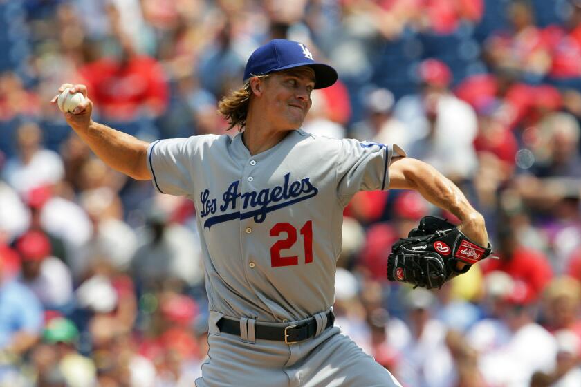 Dodgers right-hander Zack Greinke throws a pitch during the first inning of a game Thursday against the Philadelphia Phillies.