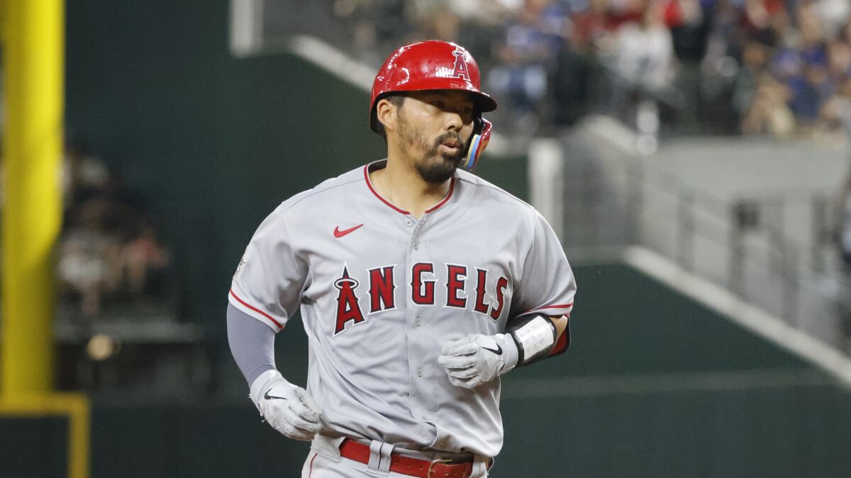 Los Angeles Angels' Kurt Suzuki runs the bases after hitting a home run.