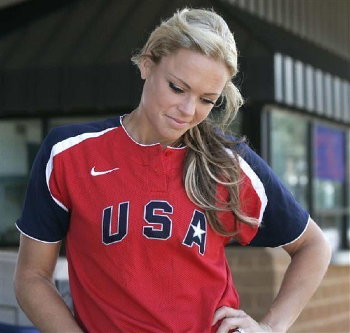 Olympic gold medalist Jennie Finch looks down as she contemplates a question about her decision to retire during an interview in Oklahoma City, Tuesday, July 20, 2010. (AP Photo/Sue Ogrocki)