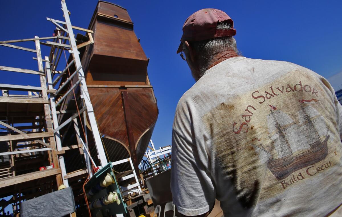 Shipwright Jeff Saar passes the stern of a full-sized, historically accurate replica of the San Salvador galleon that he and his crew are building in San Diego.