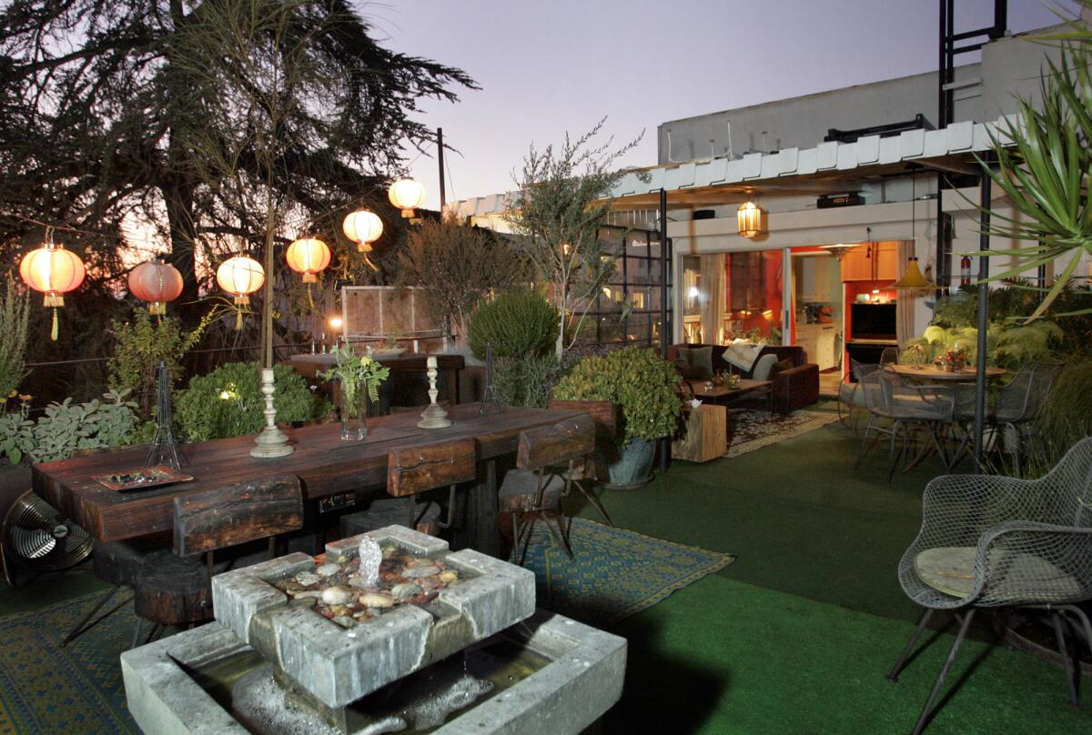 Paper lanterns illuminate the terrace of this Koreatown apartment.  