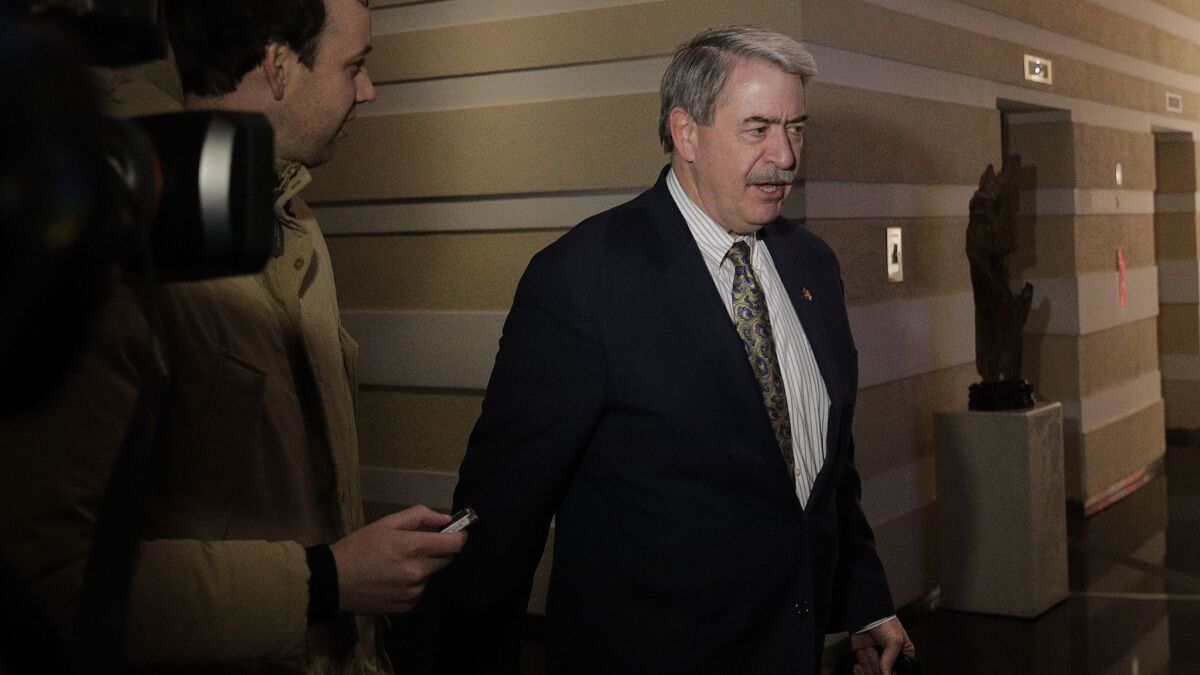 U.S. Undersecretary for Trade and Foreign Agricultural Affairs Ted McKinney is questioned by journalists as he walks into a hotel Jan. 8 after a second day of meetings with Chinese officials in Beijing.