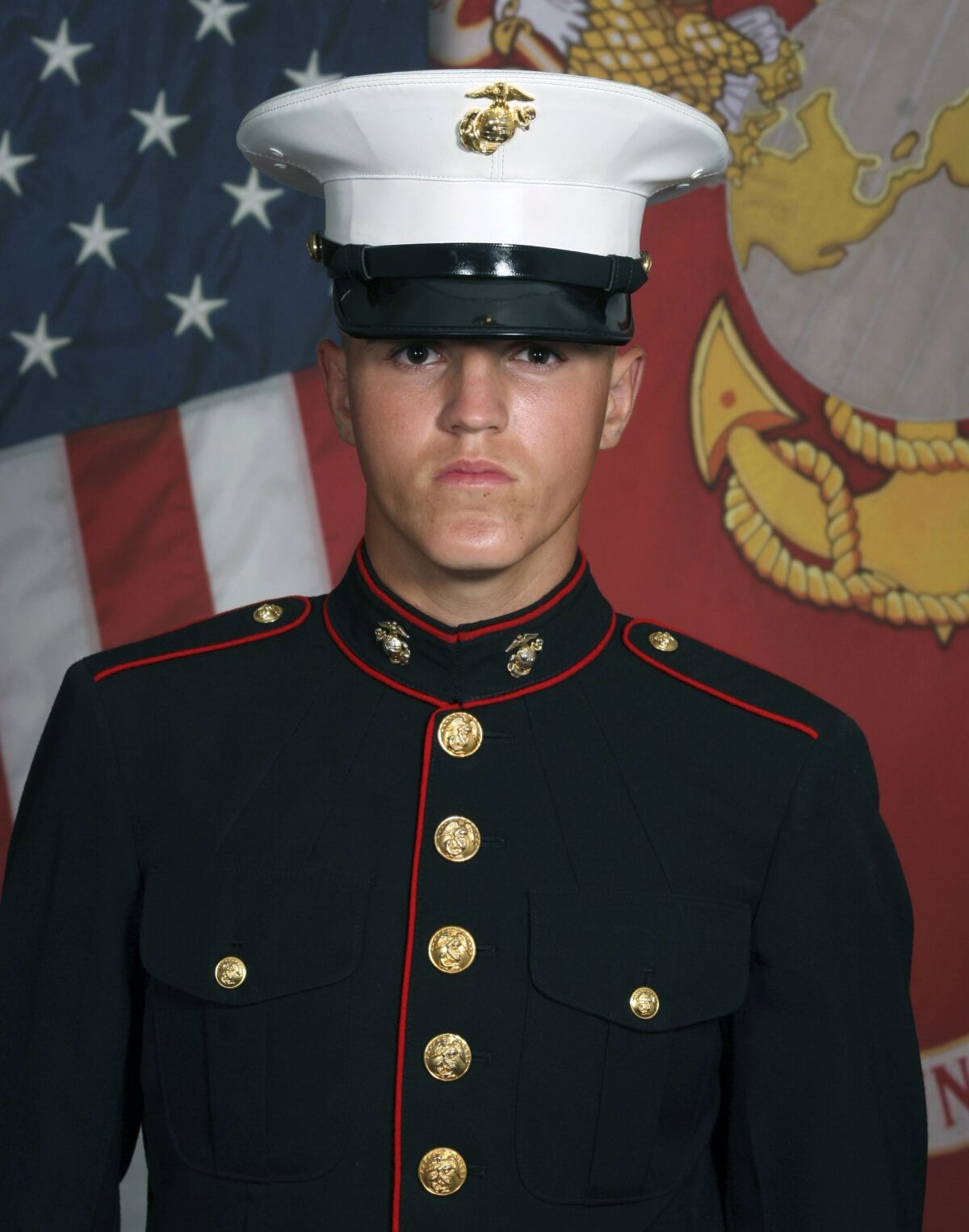 FILE - In this undated photo provided by the 1st Marine Division, Camp Pendleton/U.S. Marines, Lance Cpl. Rylee J. McCollum, 20, is pictured. McCollum was among 13 U.S. soldiers killed in a suicide bombing Aug. 26, 2021, at the airport in Kabul, Afghanistan. The widow and two sisters of McCollum are suing actor Alec Baldwin, alleging he exposed them to a flood of social media hatred and insults by claiming on Instagram that one sister was an "insurrectionist" for participating in the Jan. 6, 2021, demonstration in support of former President Donald Trump in Washington, D.C. (U.S. Marines via AP, File)