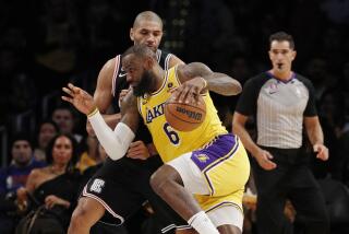 Lakers forward LeBron James (6) drives to the basket against LA Clippers forward Nicolas Batum (33).