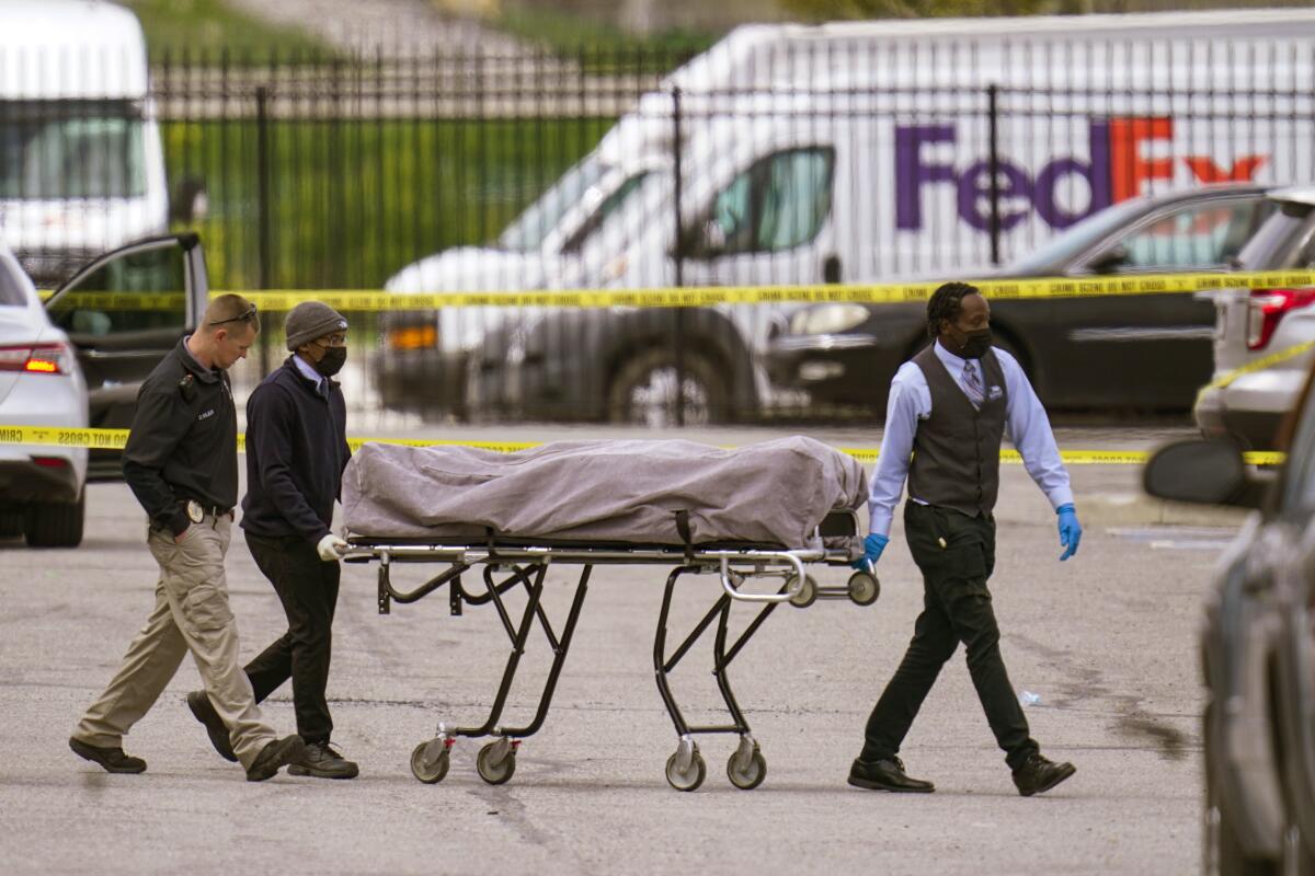 A body is taken from the scene where multiple people were shot at a FedEx Ground facility in Indianapolis.