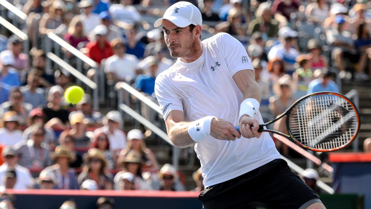 Andy Murray returns a shot against Novak Djokovic during the Rogers Cup championship match on Sunday in Montreal.