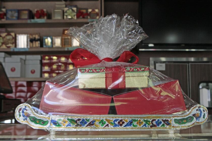 Gift boxes of sweets are packaged for Diwali at Surati Farsan Mart restaurant in Artesia, CA.