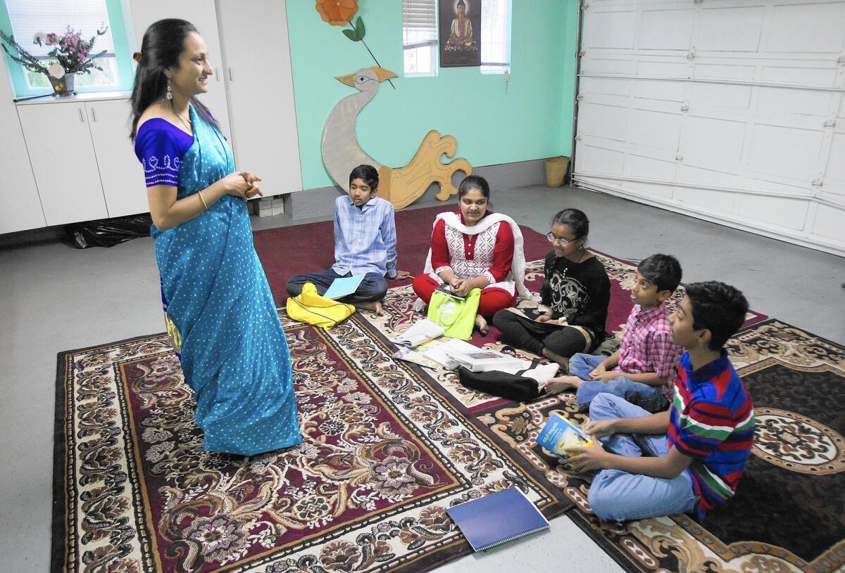 Vidya Tandanki hosts the Telugu Thota school in her Irvine home to teach children the ancient language.