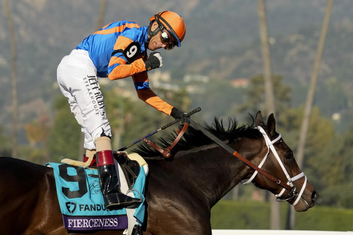 John Velazquez celebrates after riding Fierceness to victory in the Breeders' Cup Juvenile at Santa Anita.