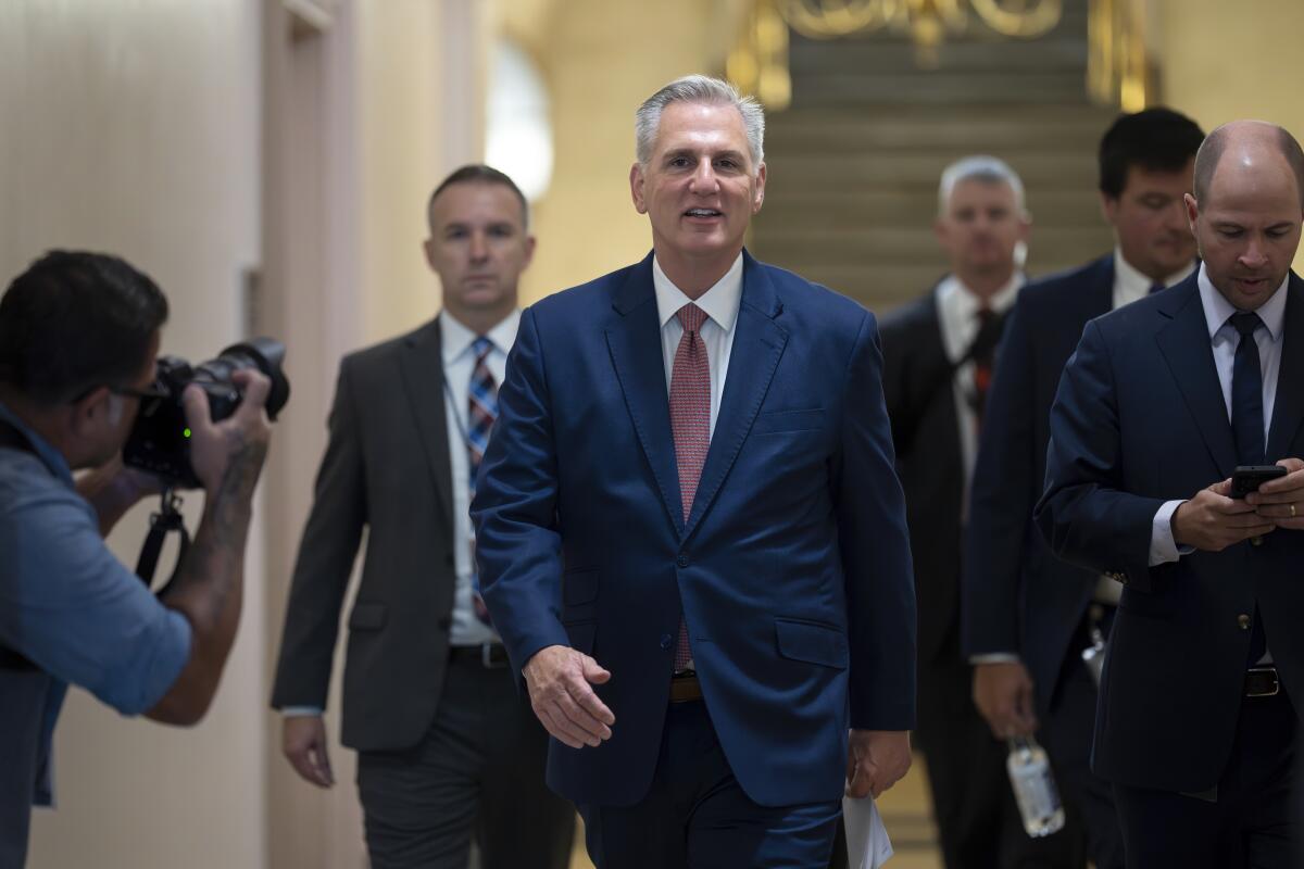 Kevin McCarthy walks through the halls of the Capitol