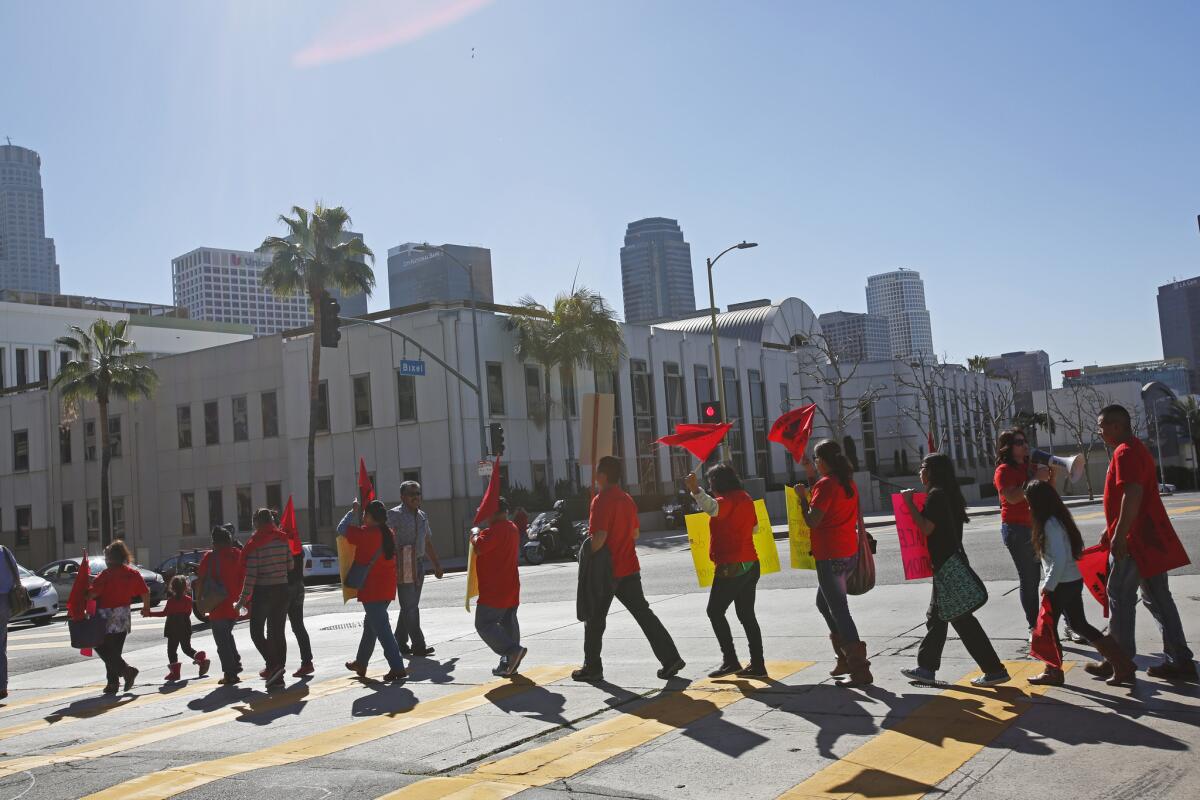 Members of the United Farm Workers march to L.A. Unified School District headquarters before a Feb. 10 on a proposal to support their efforts to win a contract in the Fresno area.