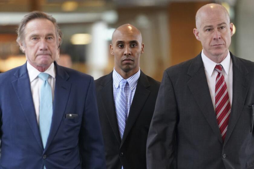 Former Minneapolis police officer Mohamed Noor heads into Hennepin County Government Center in Minneapolis to hear the verdict in his trial, Tuesday, April 30, 2019. The Minneapolis police officer was convicted of murder in the fatal shooting of an unarmed woman who approached his squad car minutes after calling 911 to report a possible rape behind her home. (Renee Jones Schneider/Star Tribune via AP)