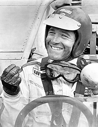A racing Paul Newman shown here in 1971. Highly competitive, Newman was drawn to the track, he told reporters, because in racing, unlike acting, the definition of "good" is not a murky matter of opinion. Although he began to race at 47, he was ranked among the sport's top 25% of drivers, his team placing second in the prestigious Le Mans endurance contest in 1979. At 70, he became the oldest driver to place in a professionally sanctioned auto race when his team took third in the 24-hour race at Daytona, Fla. -- Lynn Smith, Los Angeles Times Staff Writer