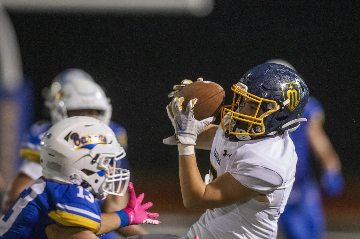 Marina's Micah Rhoads makes a catch during a game against Fountain Valley at Huntington Beach High on Friday.